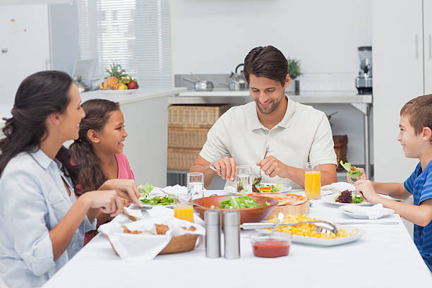 istock Family eating lettuce and pizza 462675775