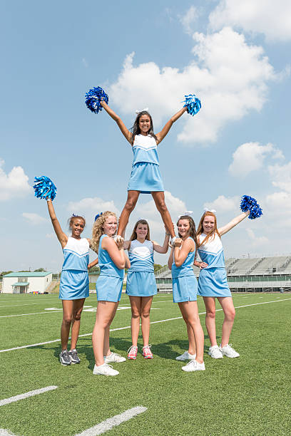 Cheerleaders Six teenage girls in a pyramid stunt cheerleader photos stock pictures, royalty-free photos & images