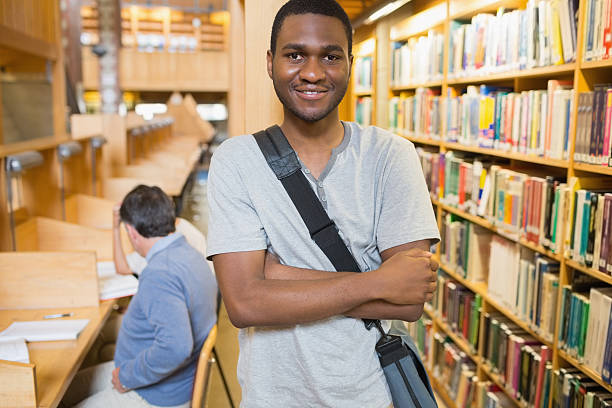 istock Student at the shelves of a library 462679507