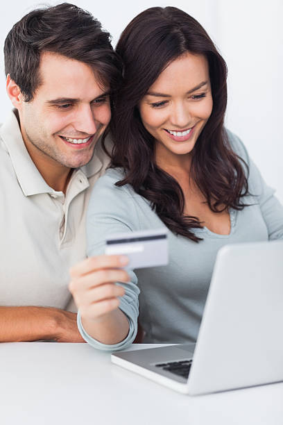 istock Couple buying online with a credit card 462679683