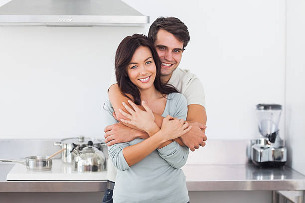 istock Man embracing his pretty wife 462679699