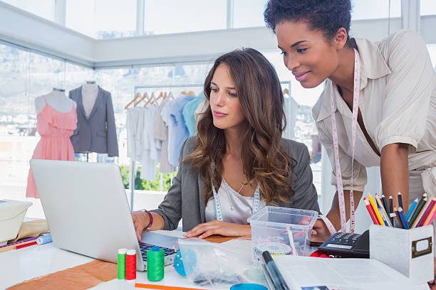 istock Two fashion designers working in a bright creative office 462680383