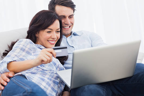 istock Couple purchasing online sitting on a couch 462680407