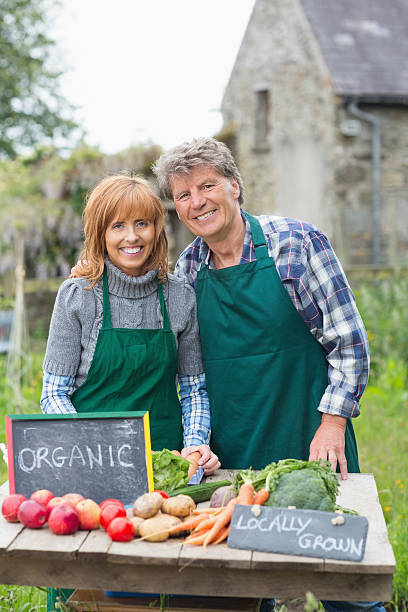 istock Content mature couple selling vegetables 462681121