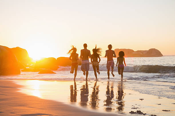 istock Young friends jogging together as the sun is setting 462681237