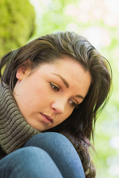 istock Worried woman reflecting in green forest 462681335