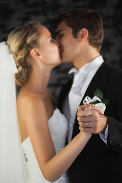 Beautiful young Caucasian newlyweds in nature in autumn.