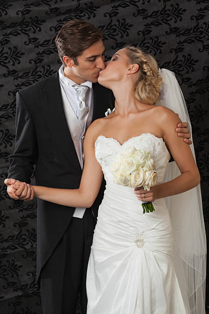 istock Calm elegant young newlyweds posing kissing 462682405