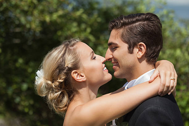 istock Delighted young newlyweds looking each other 462682501