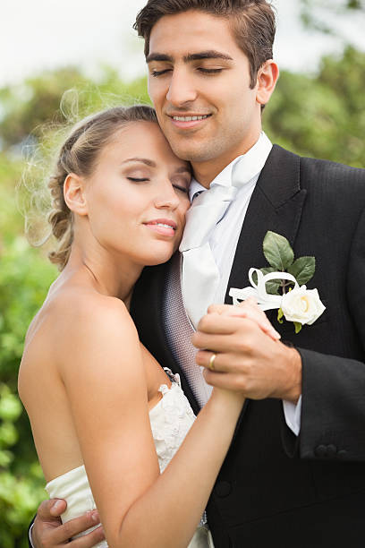 istock Peaceful young newlyweds embracing with eyes closed 462682559