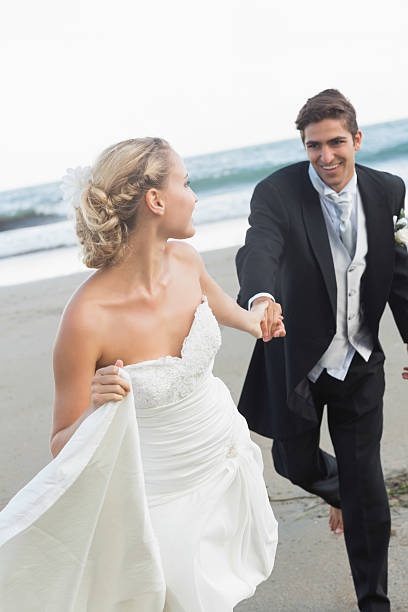 istock Joyful lovely young bride leading her handsome husband 462714823