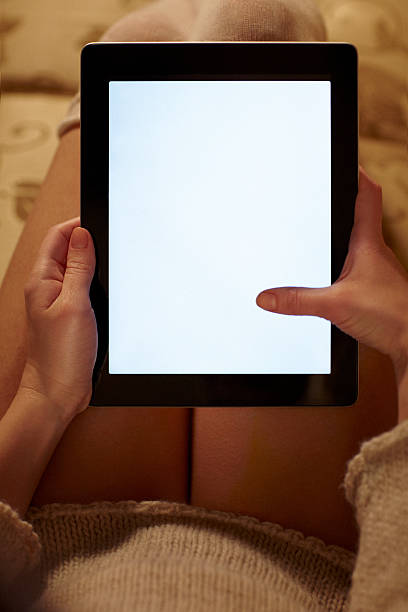 istock Close-up of a digital tablet in young woman's lap 462715535