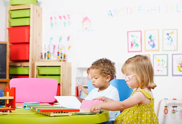 istock Toddlers Reading In A Nursery Setting 462719181