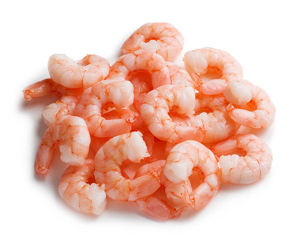 istock Cooked and peeled king prawns on a white backgound 462719961