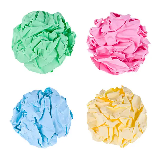 Photo of Collection of crumpled paper balls on white