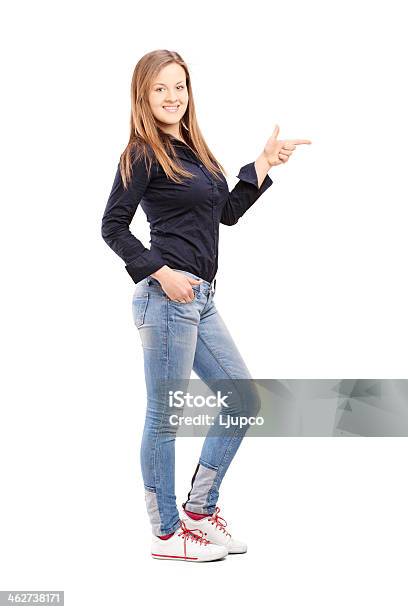 Young Casual Woman Pointing With Hand Stock Photo - Download Image Now - 20-29 Years, Adult, Adults Only