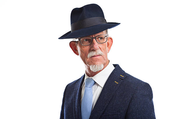 istock Serious well dressed senior man with hat. Isolated. 462738537