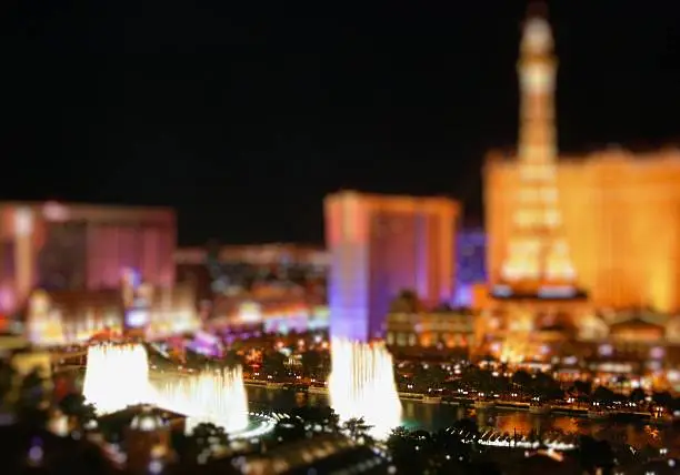 A well coloured picture of the Las Vegas Strip with a toy effect and some fountains