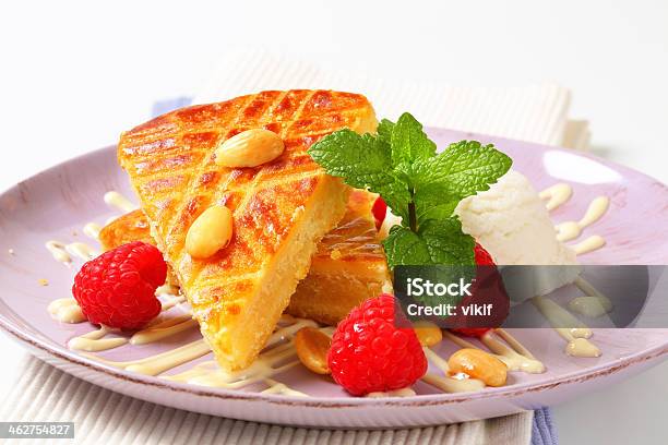 Almond Cake With Ice Cream And Raspberries Stock Photo - Download Image Now - Almond, Baked, Cake