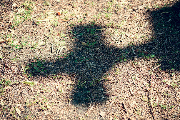 istock shadow of a cross on dirty floor 462757489