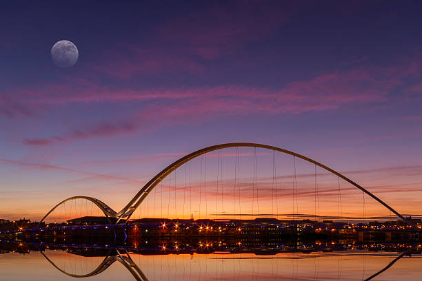 The infinity bridge at dusk from a distance