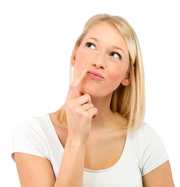 istock Blonde girl looking up thinking isolated 462765909