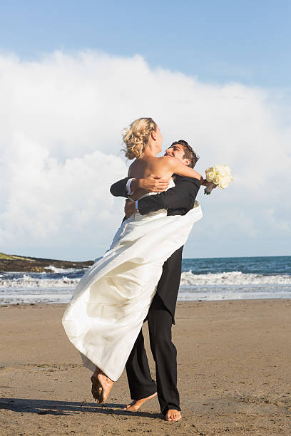 istock Happy lovely young newlyweds posing embracing 462770399