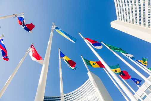 New York, NY, USA - June 7, 2022: Country flags flying in front of the United Nations Secretariat building.