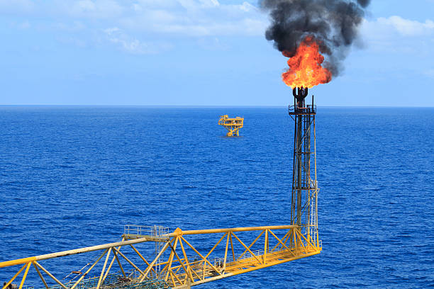 istock Hot flare boom and fire on offshore production platform 462771681