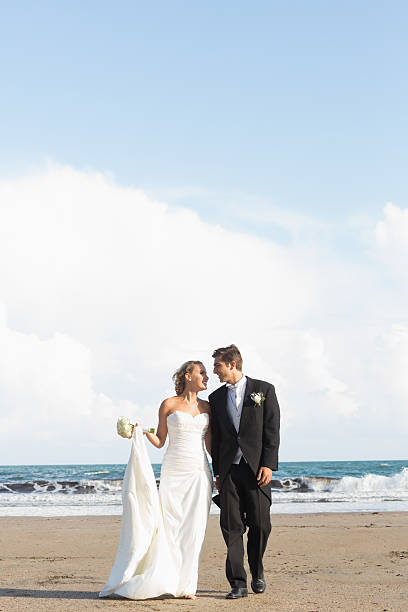istock Cheerful lovely young newlyweds walking together 462772889