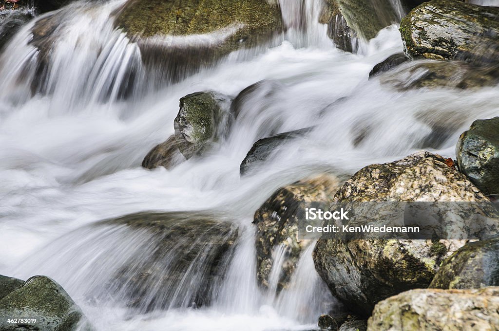 Mountain Strem Rushing water cascades over granite boulders in a stream in Granville, Vermont. Autumn Stock Photo