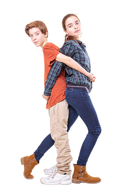 istock brother and sister back on b ack 462796707