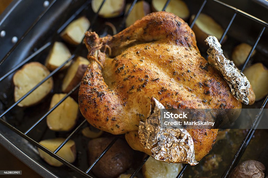 oven roasted chicken with potatoes Oven roasted chicken with potatoes just out of the oven. Baked Stock Photo