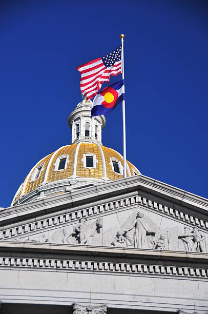 istock Colorado Capitol - state and US flags 462805689