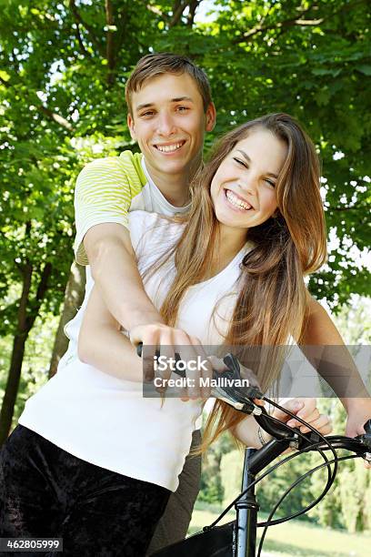 Happy Travellerson A Bicycle Stock Photo - Download Image Now - Active Lifestyle, Activity, Adult