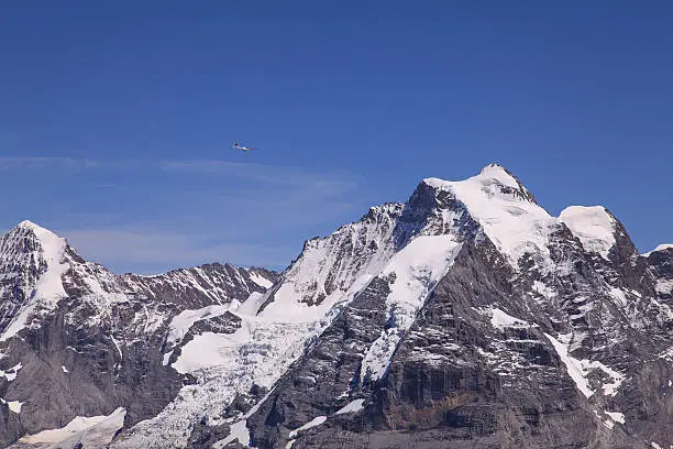 Plane & Mountains - view from Mt. Schilthorn, Switzerland.
