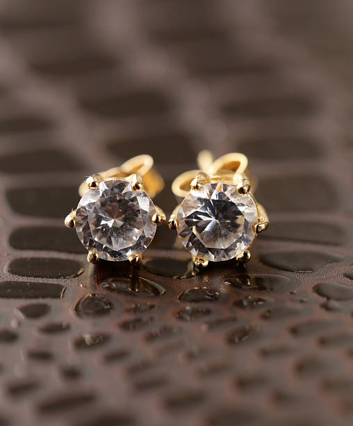 gold earrings stud with diamonds macro shot