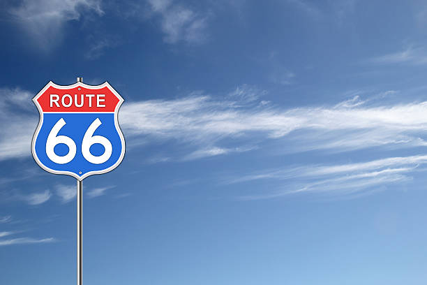 Route 66 Road Sign. Red and blue Route 66 Road Sign isolated on blue sky background. number 66 stock pictures, royalty-free photos & images