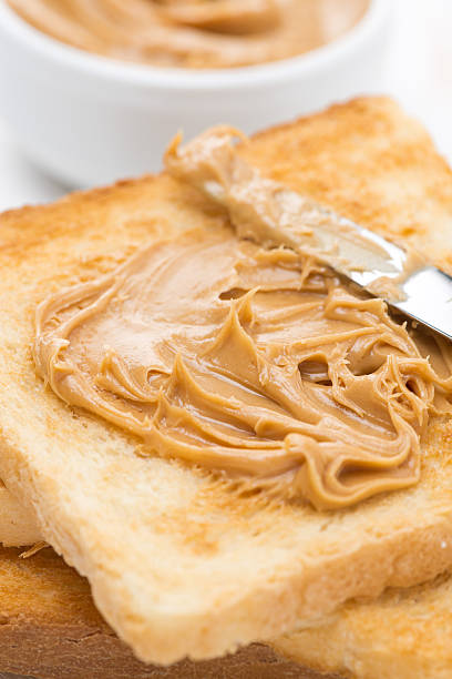 istock toast with peanut butter, close-up 462813193