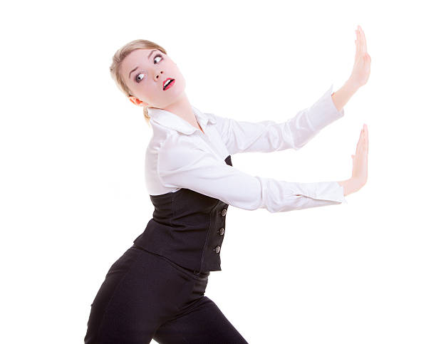 istock Business woman pushing away invisible obstacles copy-space isolated 462813421