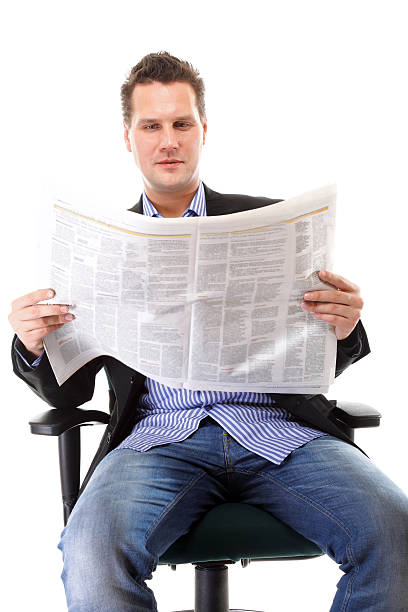 istock Businessman reading a newspaper isolated 462815045