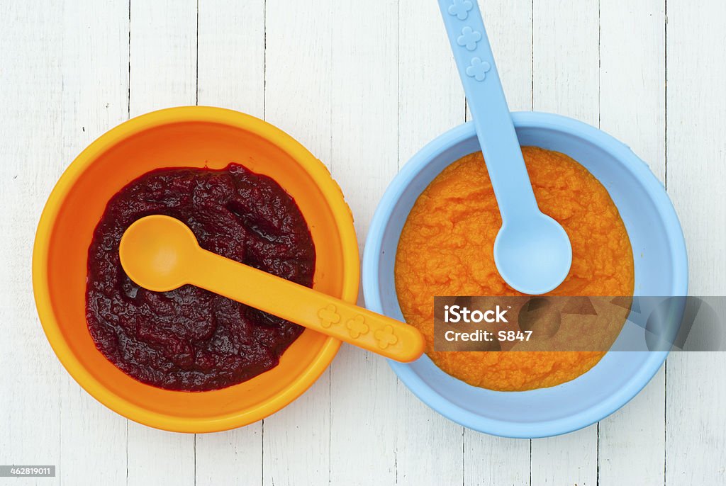 Baby foods baby foods from pumpkin and beet on white wood table, top view Baby Food Stock Photo