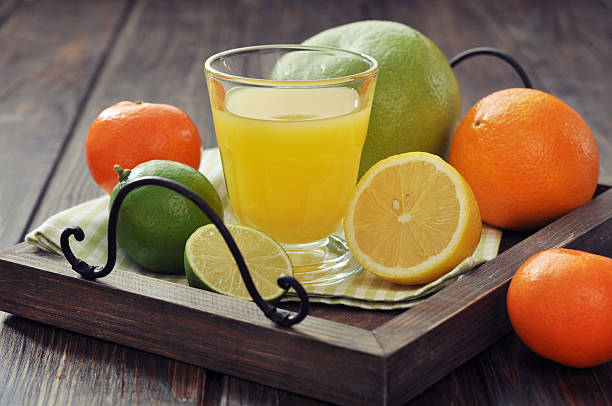 istock Citrus juice and fruits 462819459