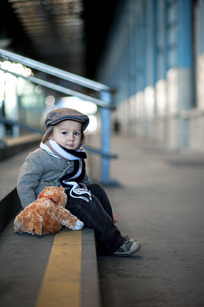 istock Little boy on a railway station 462835223