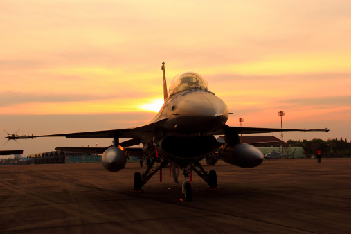 Beja, Portugal: parked General Dynamics F-16 Fighting Falcons of the Portuguese Air Force - in the foreground a twin-seat F-16 BM version, the rest are F16 AMs - equipped with external fuel tanks - Beja Airport serves both civil and military aviation.