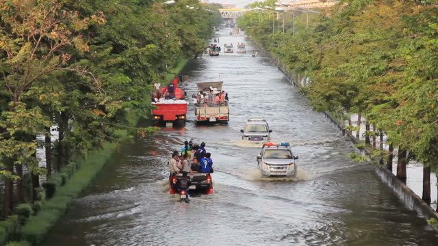 Emergency truck lead the patient to the hospital on flood situation.