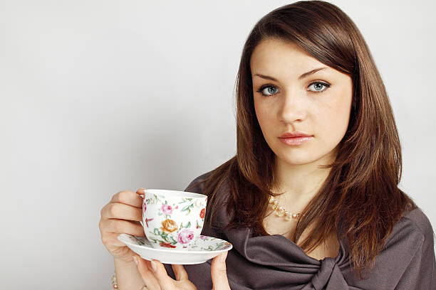 istock woman holds cup with tea 462844559
