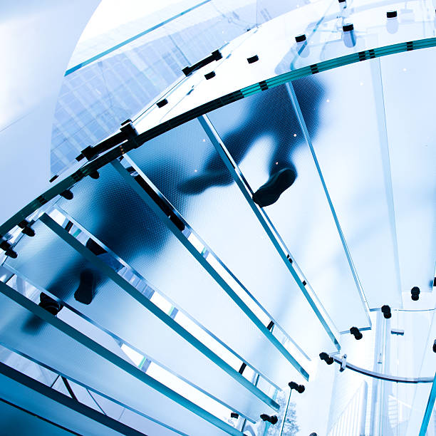 istock people on glass staircase 462846451