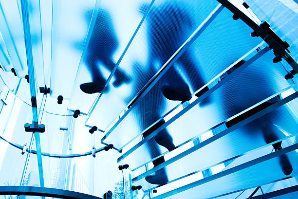 istock people on glass staircase 462846469