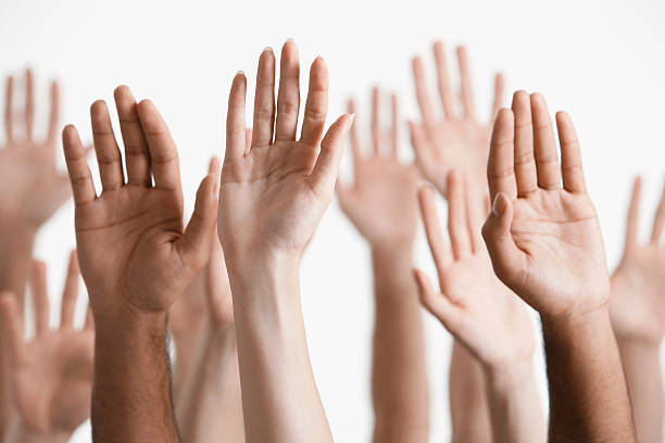 istock Closeup Of Raised Multiethnic Hands 462848199